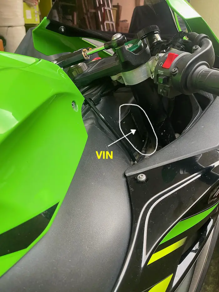 Photo showing a green Kawasaki ZX 10R from around the right fork area where it meets the tank