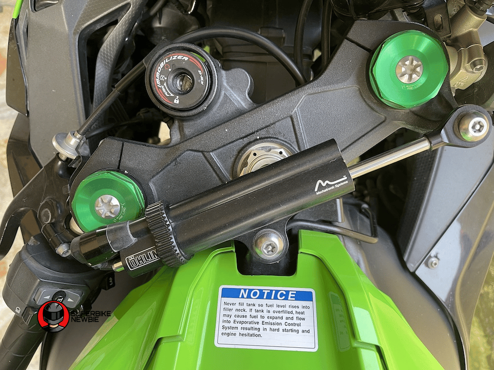 The image shows a close up of the steering dampeners on a Kawasaki ZX-10R, 2018 model.