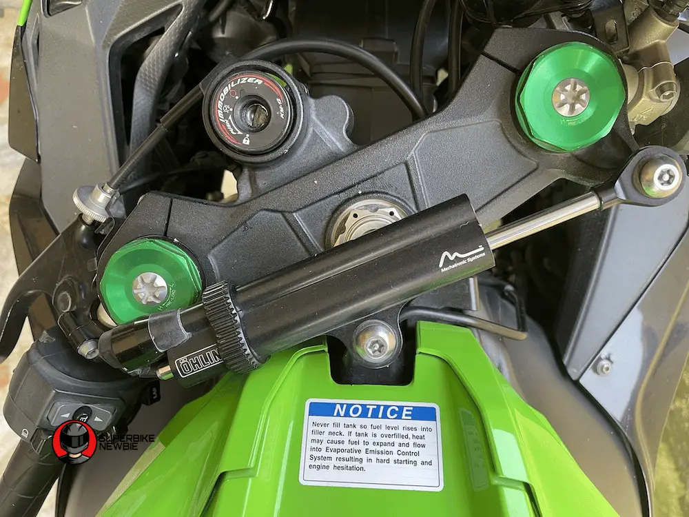 The image shows a close up of the steering dampeners on a Kawasaki ZX-10R, 2018 model.